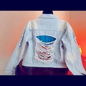 Unisex denim jacket with custom peek-a-boo interior. Size large runs small.